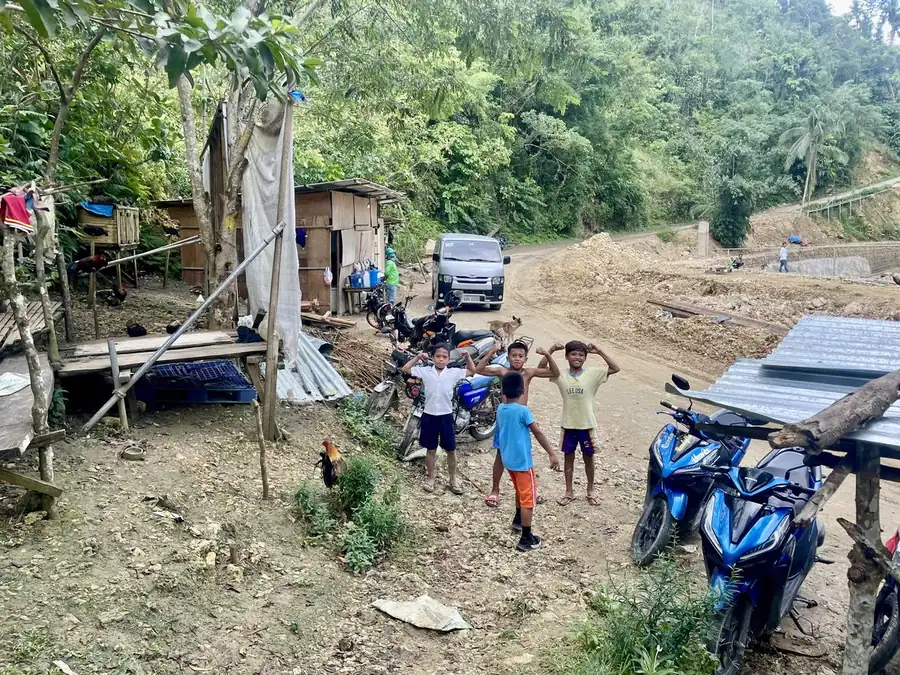 Children playing on a mountain road